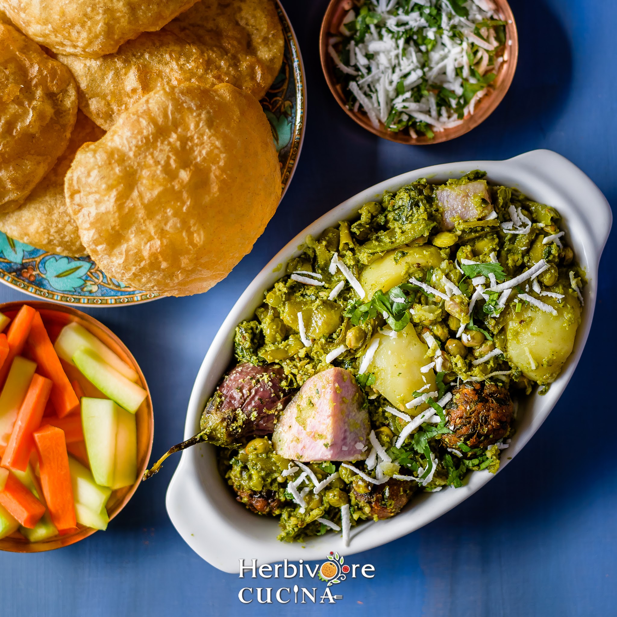 Undhiyu in an oval bowl with puris in a plate and salad and shredded coconut around it. 