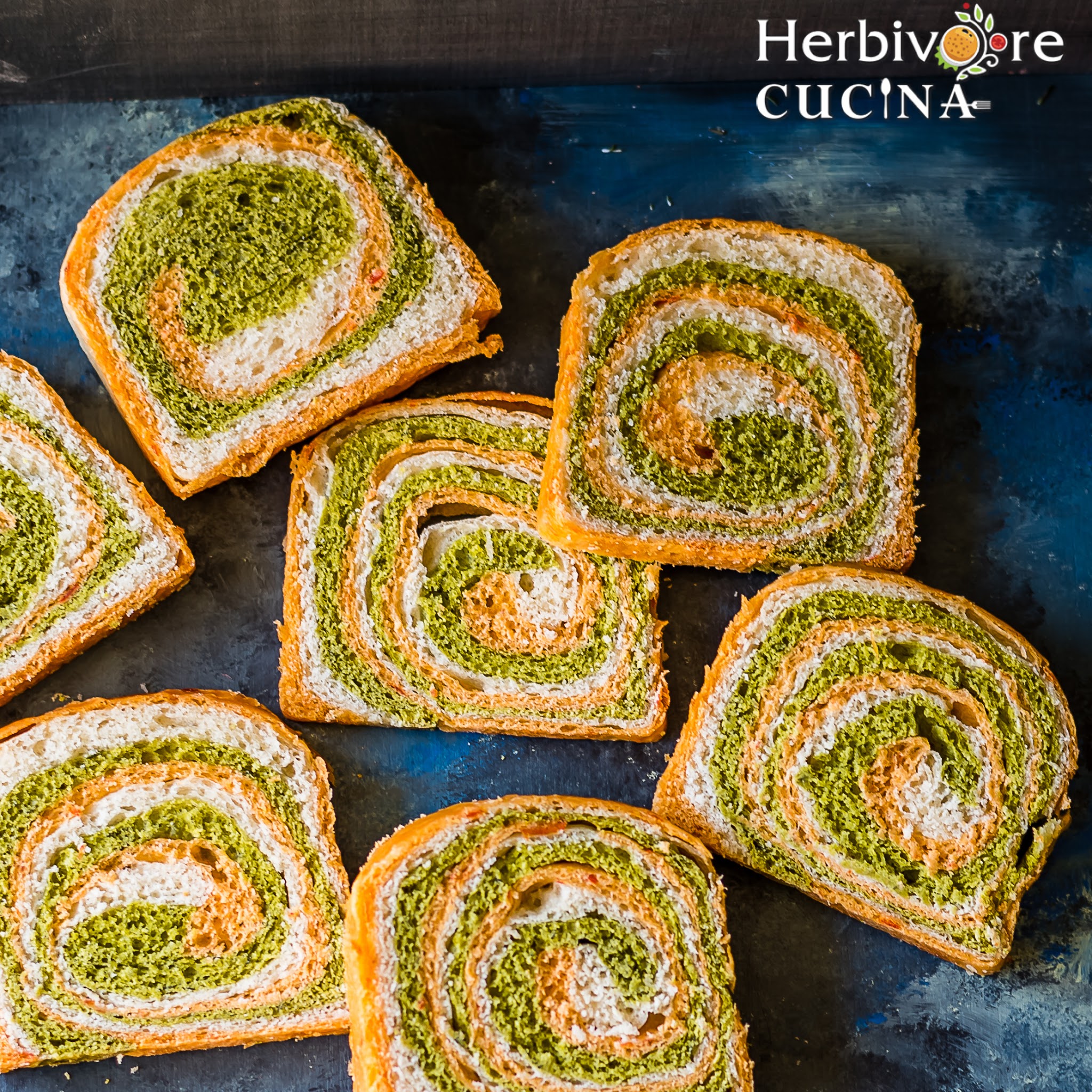 Seven slices of tricolor bread on a dark background. 