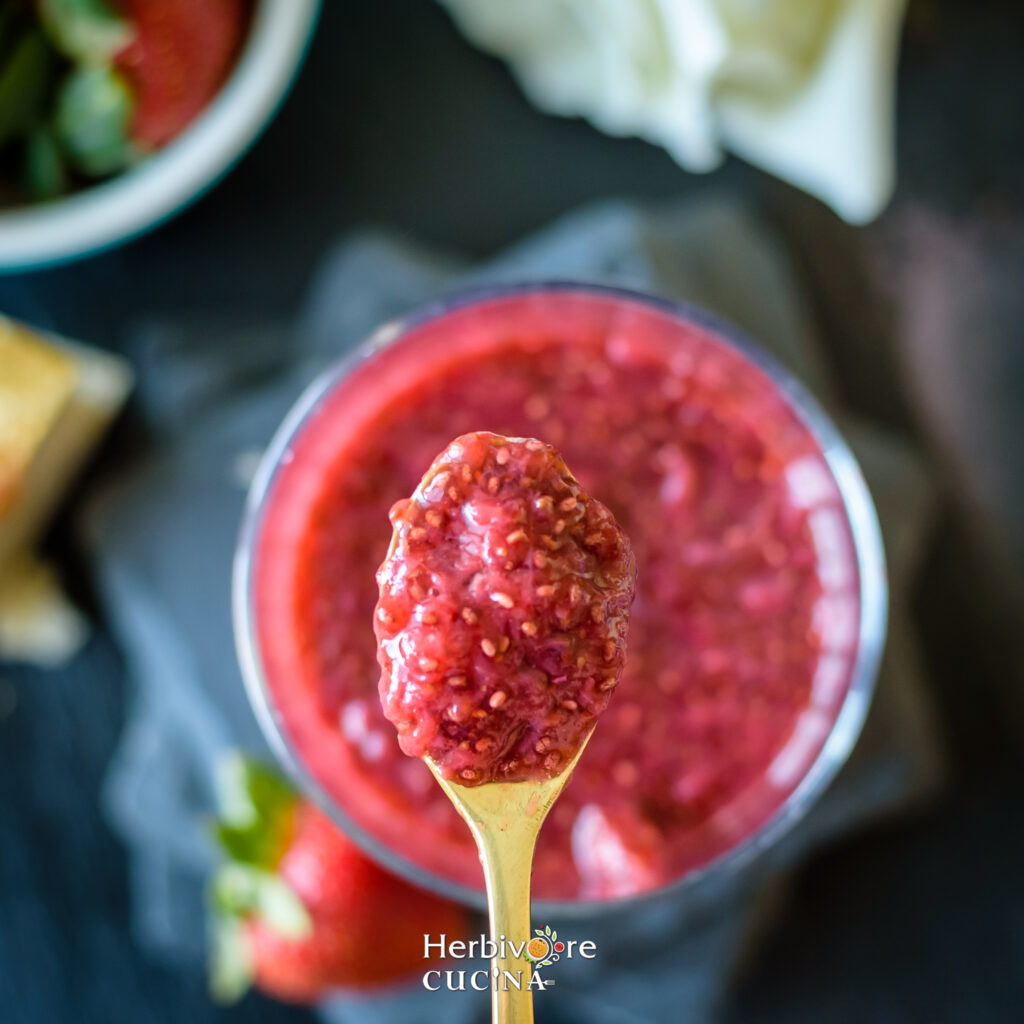spoon with strawberry chia jam