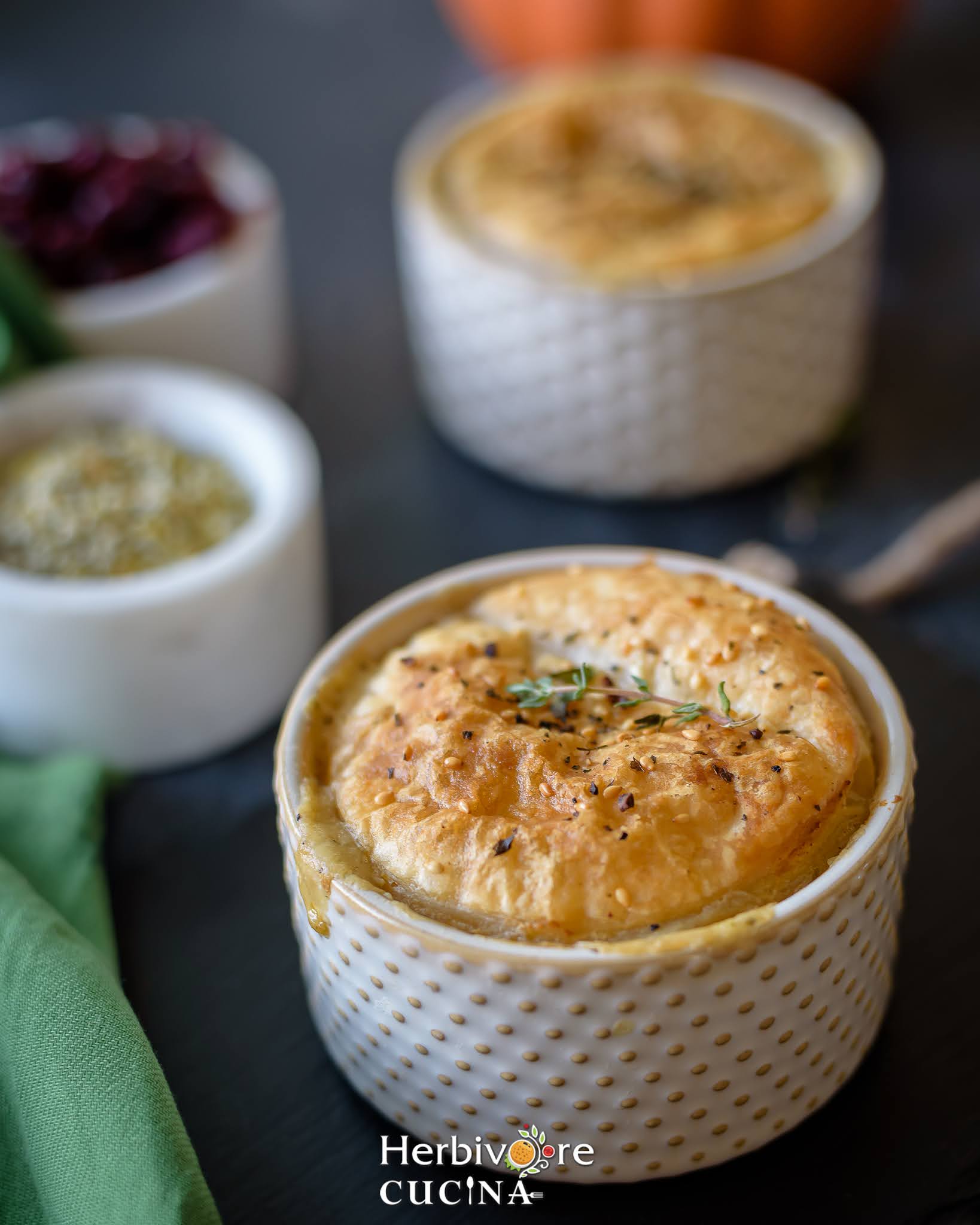 Ramekins filled with creamy mixed vegetables and topped with puff pastry; air fried to perfection and served topped with herbs. 