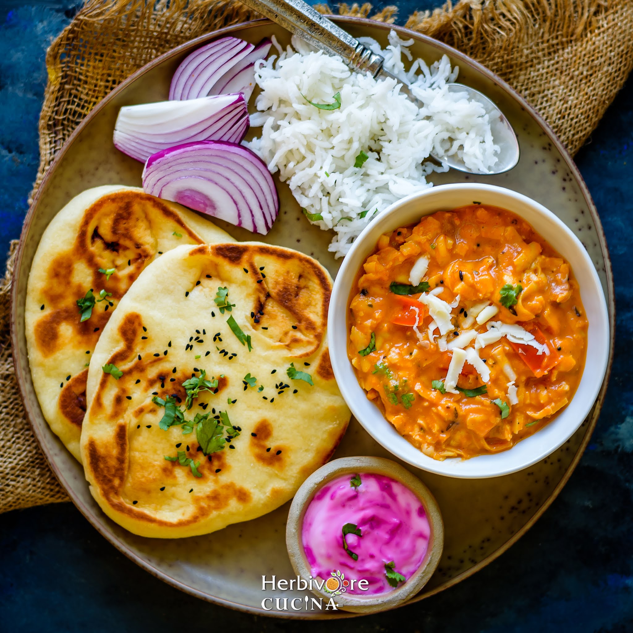 Indian Thali-naan, paneer akbari, rice, salad and raita