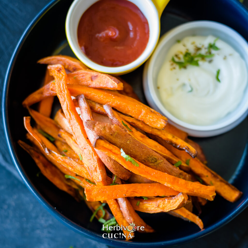 Close up of air fried sweet potato fries in a plate