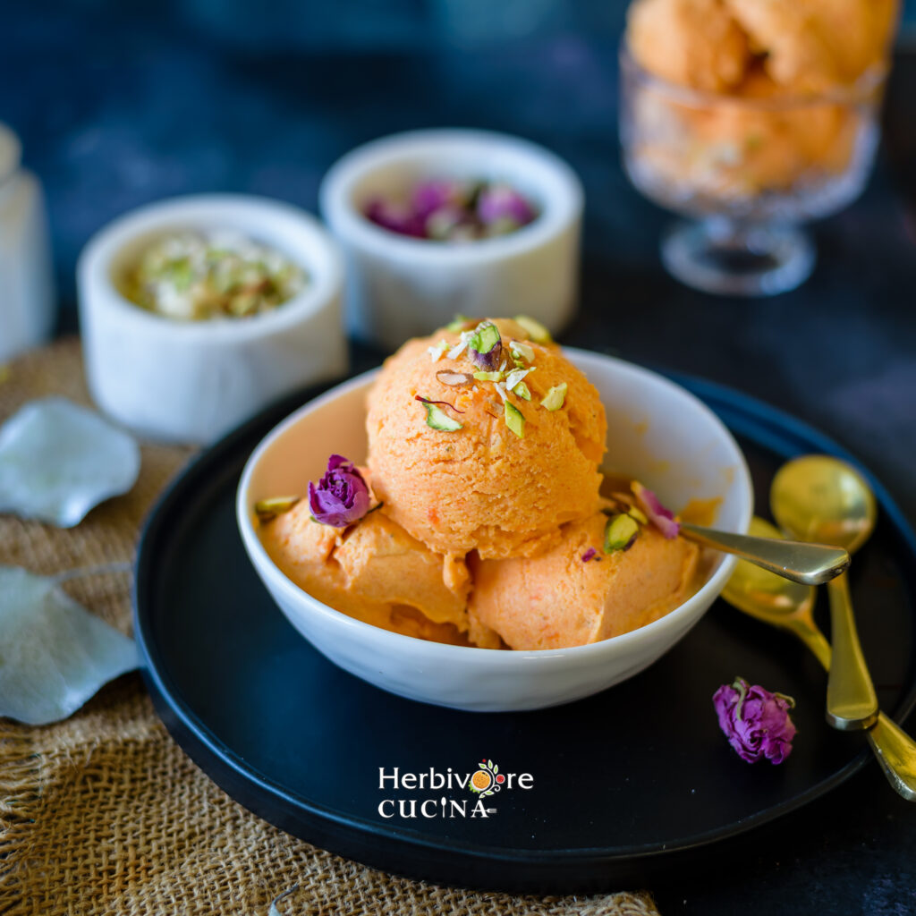 3 scoops of gajar halwa ice cream in a bowl