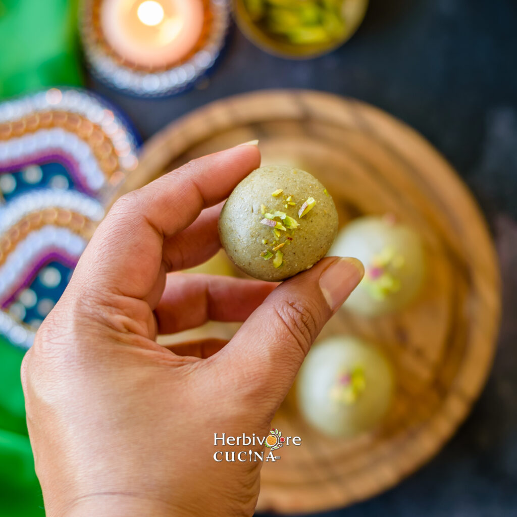 Holding a kuler ladoo in palms