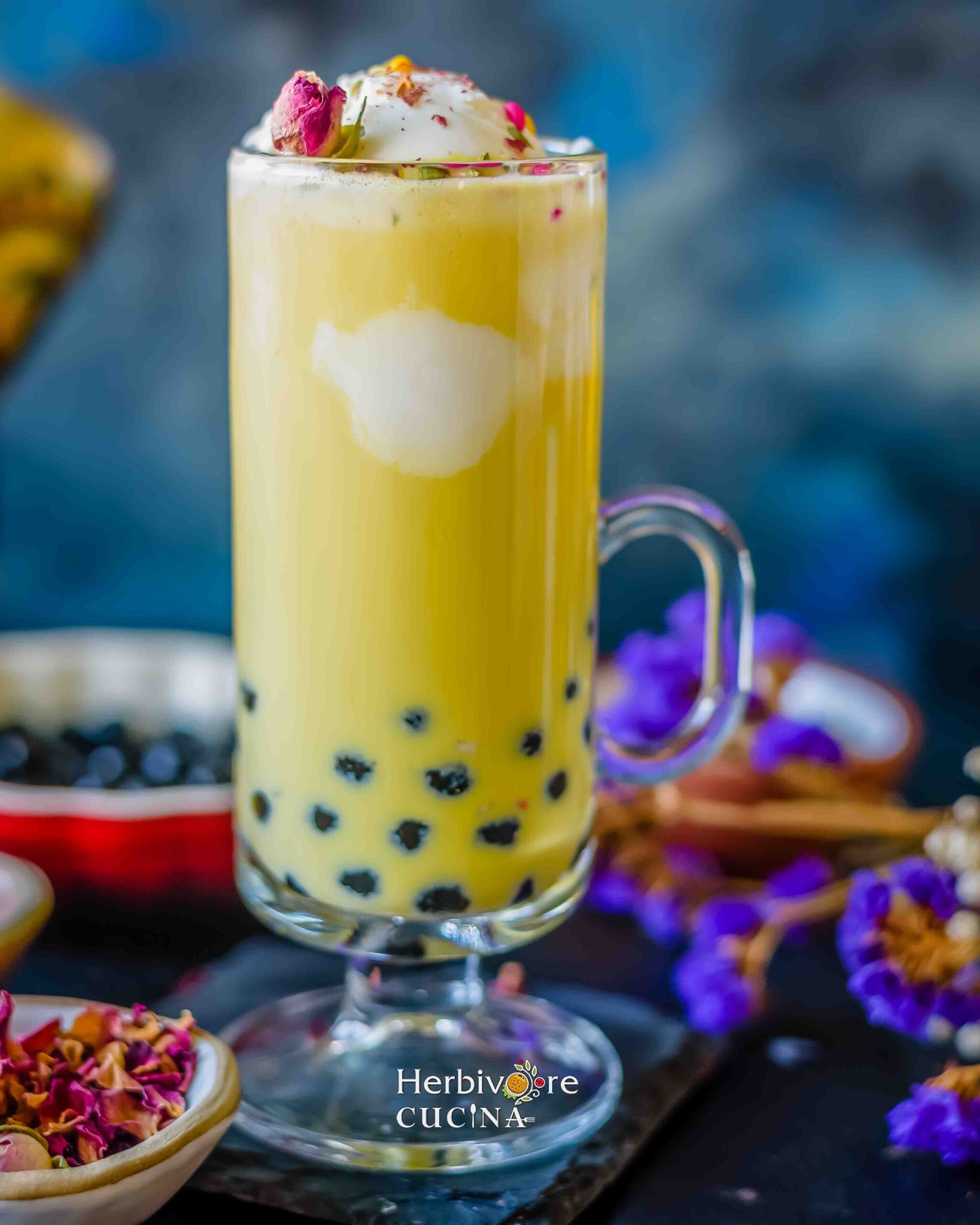 Front view of boba thandai with vanilla ice cream and toppings.