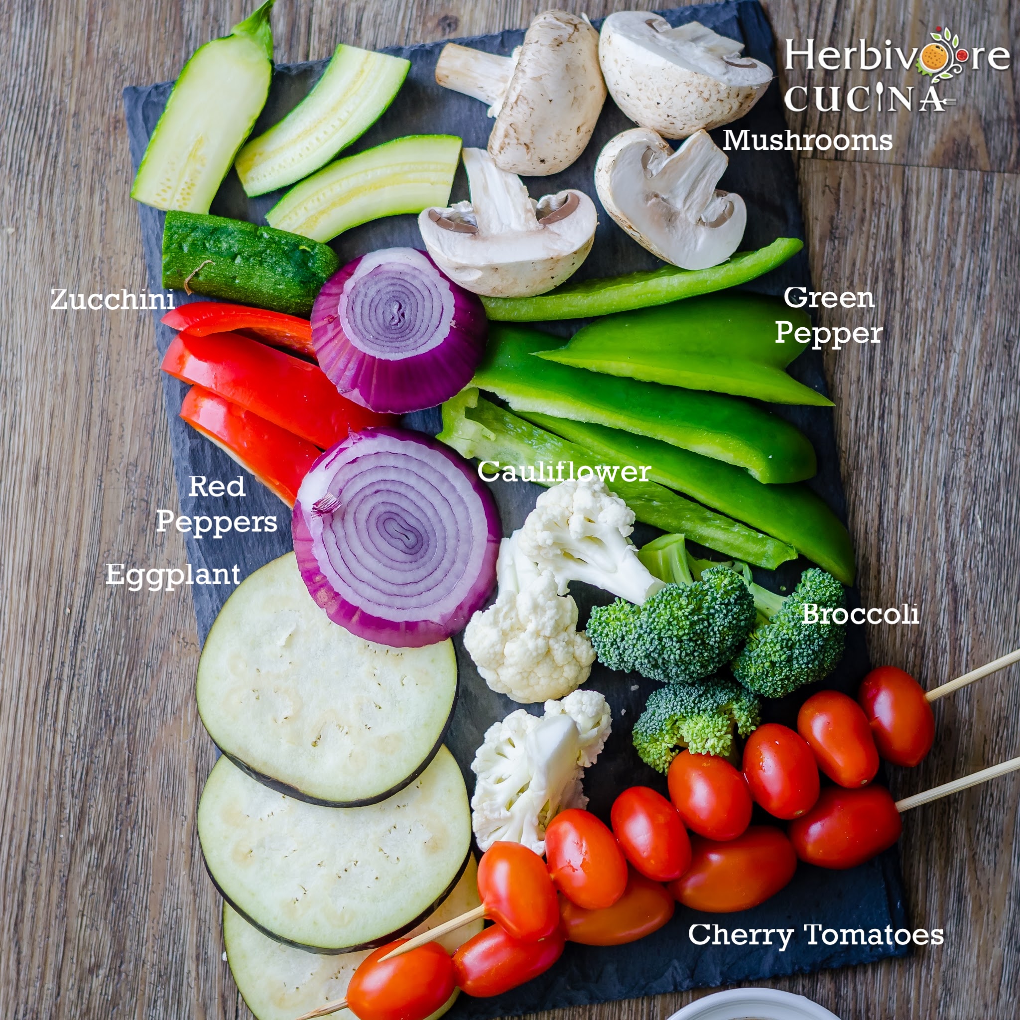 Ingredients for grilled vegetables on a slate tray. 